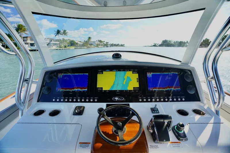 Slide: The Image of 2021 Valhalla Boatworks V46 helm with advanced navigation displays and controls. - 17