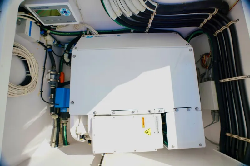 Slide: The Image of Electrical system inside 2021 Valhalla Boatworks V46, featuring cables and control panel. - 24