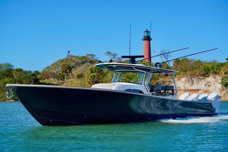 Slide: The Image of 2021 Valhalla Boatworks V46 cruising near a lighthouse on a sunny day. - 5