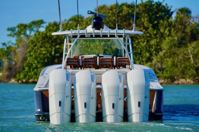 Slide: The Image of 2021 Valhalla Boatworks V46 with four powerful outboard engines on the water. - 8