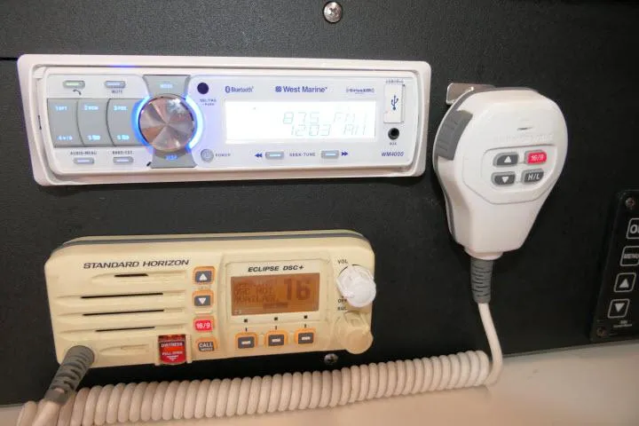 Slide: The Image of Marine radio and stereo system on a 1988 Catalina 34 sailboat dashboard. - 24