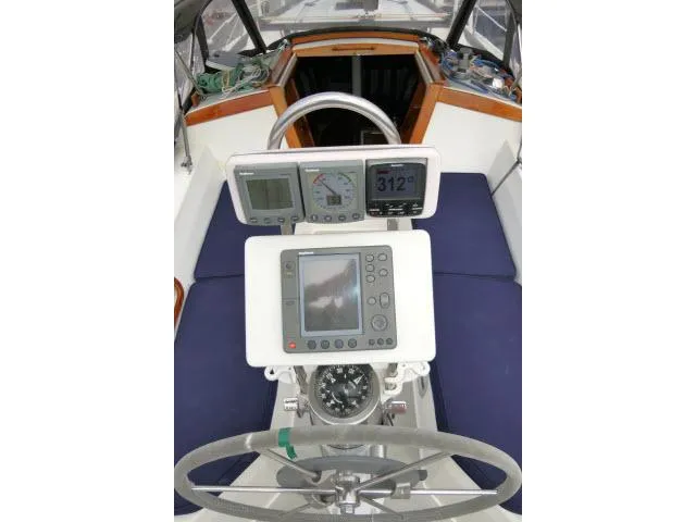 Slide: The Image of Cockpit of 1988 Catalina 34 sailboat with navigation instruments and steering wheel. - 42