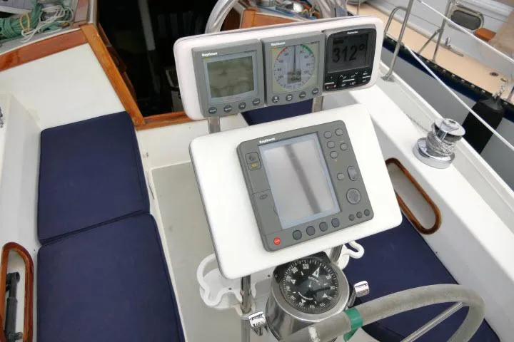 Slide: The Image of Cockpit of 1988 Catalina 34 sailboat with navigation instruments and compass. - 43