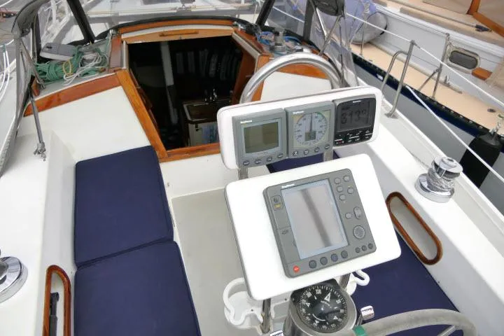 Slide: The Image of Cockpit of a 1988 Catalina 34 sailboat with navigation instruments and seating. - 44