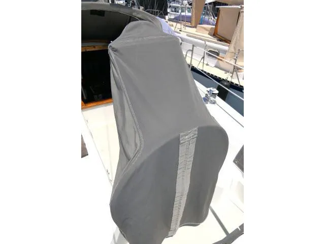 Slide: The Image of Gray cover on a 1988 Catalina 34 sailboat cockpit, docked in a marina. - 47