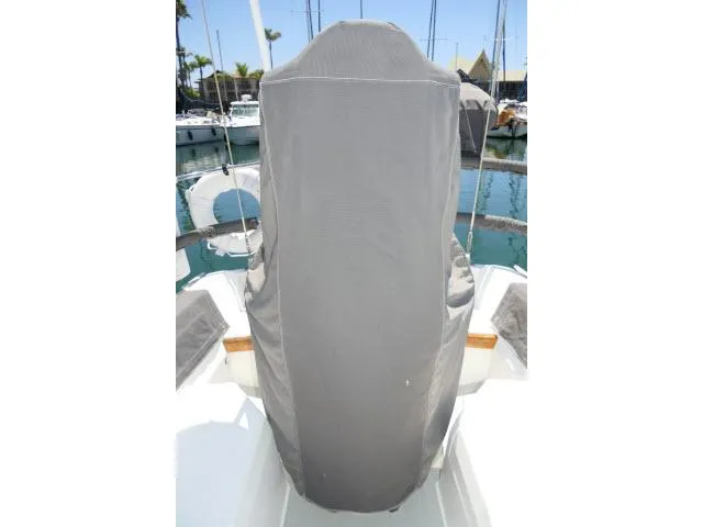 Slide: The Image of Covered helm station on a 1988 Catalina 34 sailboat in a marina. - 48