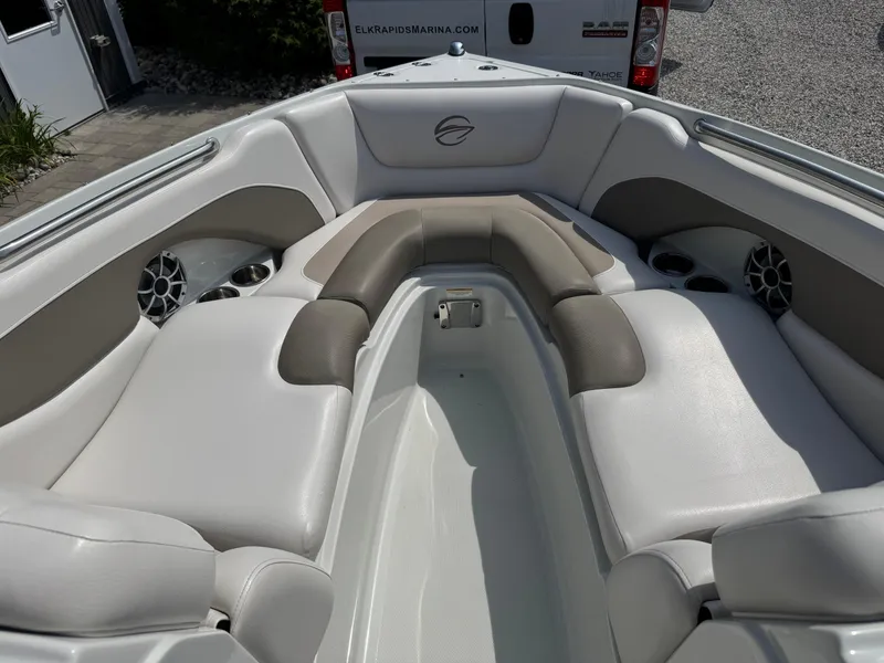 Slide: The Image of 2014 Crownline 235 SS boat interior with cushioned seating and cup holders. - 13