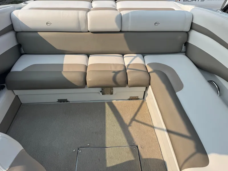 Slide: The Image of 2014 Crownline 235 SS boat interior with beige and white seating. - 6