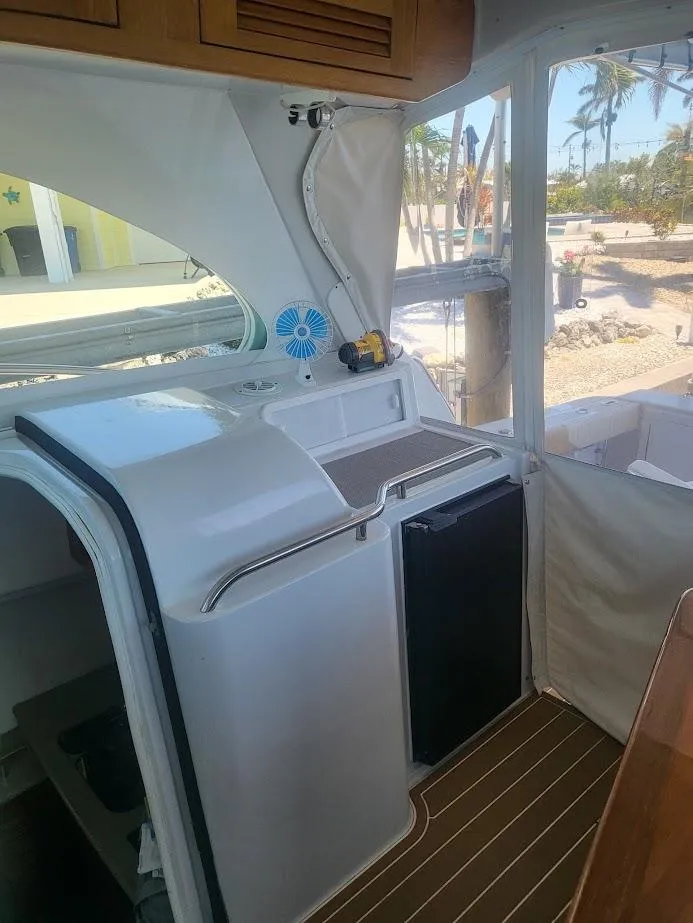 Slide: The Image of Interior of 2005 Glacier Bay 3480 Ocean Runner boat with compact kitchenette. - 10