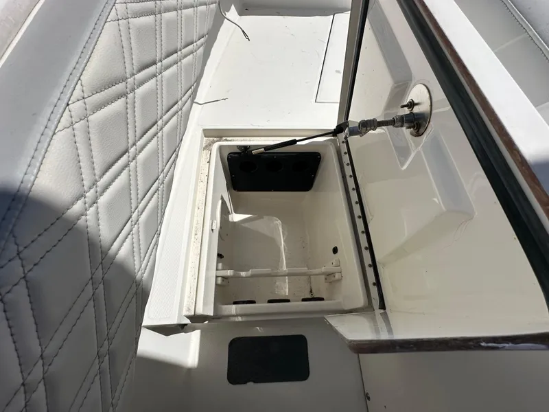Slide: The Image of Open storage compartment on 2002 Regulator 32 Forward Seating boat. - 31