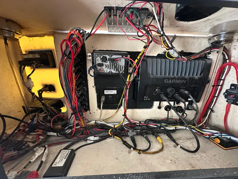 Slide: The Image of Electrical wiring and Garmin equipment inside a 2002 Regulator 32 Forward Seating boat. - 53