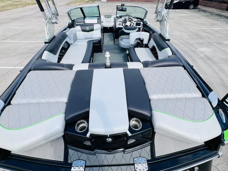 Slide: The Image of 2015 MasterCraft X25 boat interior with luxurious seating and modern dashboard. - 12