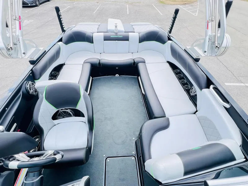 Slide: The Image of 2015 MasterCraft X25 boat interior with sleek seating and modern design. - 19