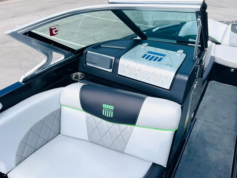 Slide: The Image of 2015 MasterCraft X25 boat interior with stylish seating and modern dashboard design. - 22