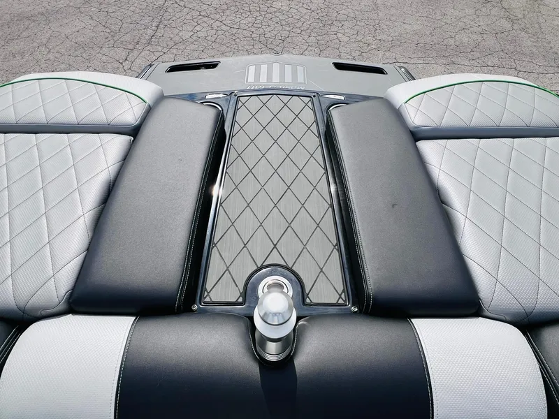 Slide: The Image of 2015 MasterCraft X25 boat interior with diamond-stitched upholstery and sleek design. - 25