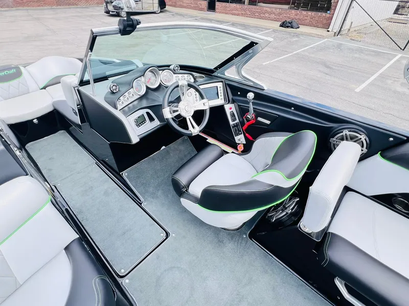 Slide: The Image of 2015 MasterCraft X25 boat interior with modern dashboard and seating. - 29