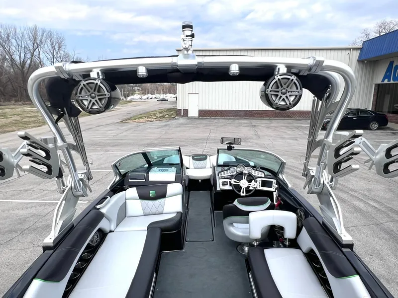 Slide: The Image of 2015 MasterCraft X25 boat interior with sleek seating and advanced audio system. - 36