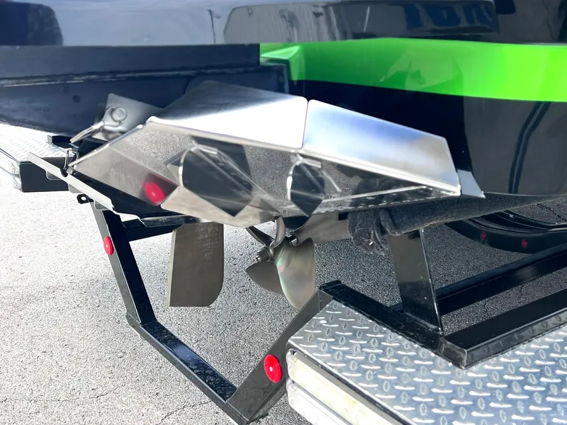 Slide: The Image of 2015 MasterCraft X25 boat propeller and rudder on trailer, close-up view. - 45
