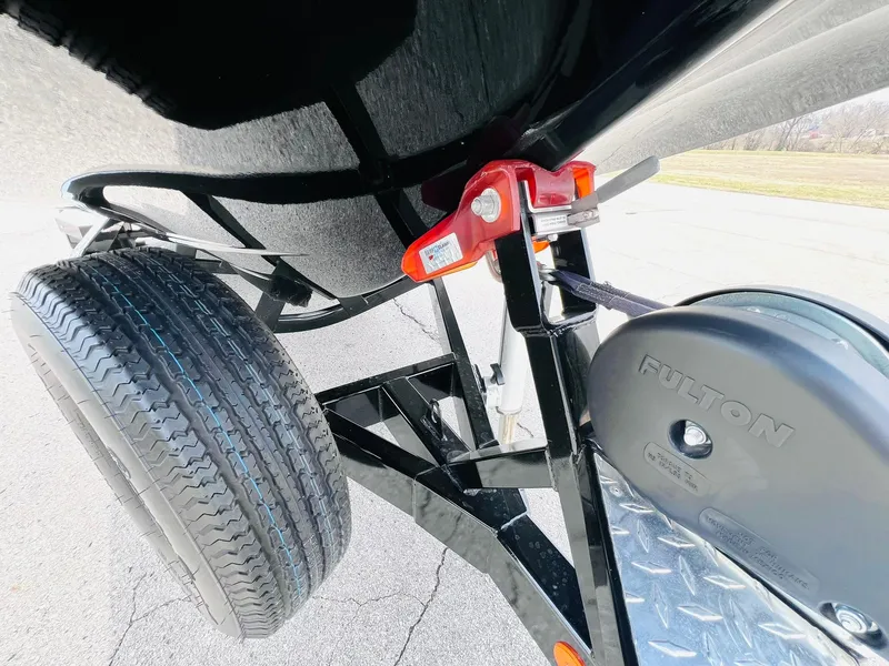 Slide: The Image of Trailer hitch and tire of a 2015 MasterCraft X25 boat. - 47