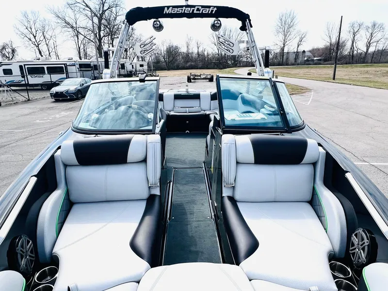 Slide: The Image of 2015 MasterCraft X25 boat interior with sleek seating and modern design. - 9