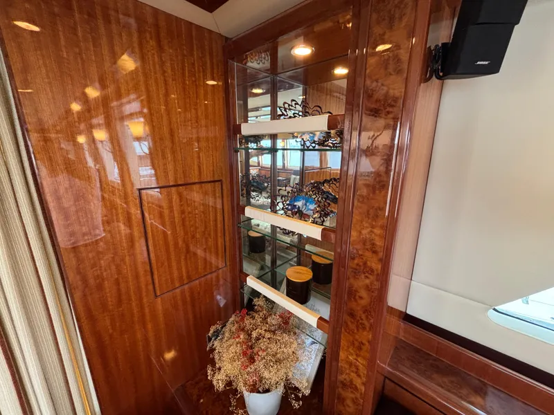 Slide: The Image of Luxurious Norseman 80 yacht interior with elegant wood paneling and decorative shelving, 2010 model. - 10