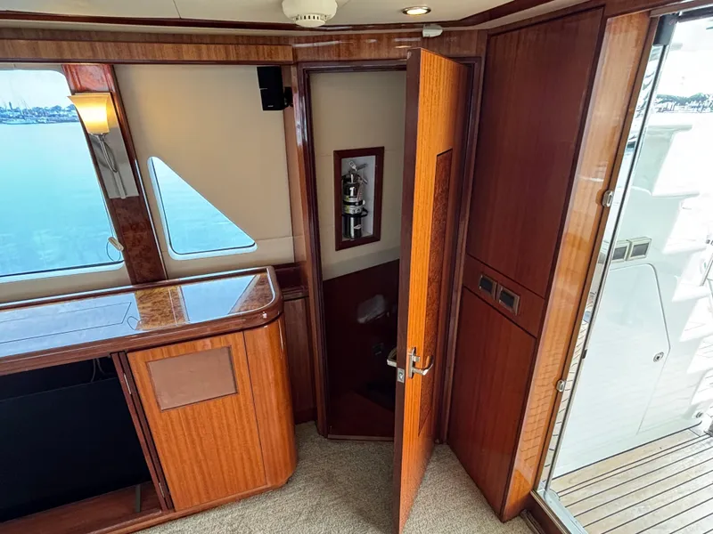 Slide: The Image of Luxurious interior of 2010 Norseman 80 yacht with wooden finishes and open door. - 11