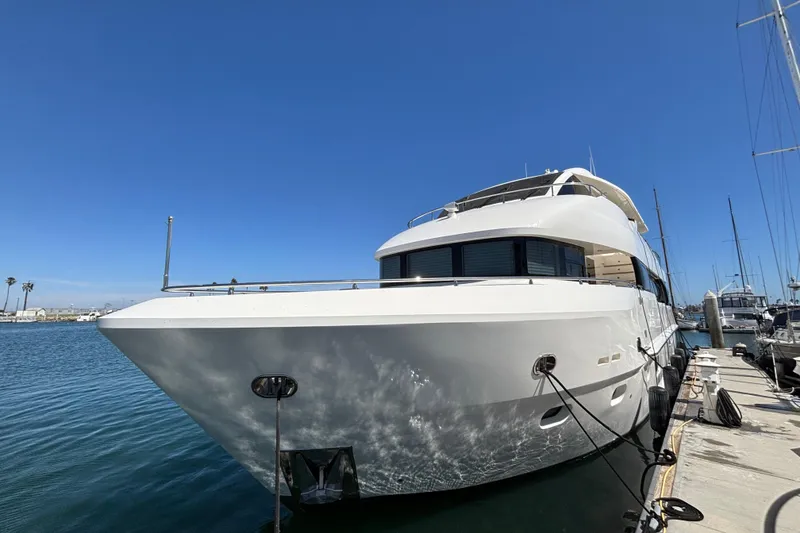 Slide: The Image of Luxurious 2010 Norseman 80 yacht docked at marina under clear blue sky. - 113