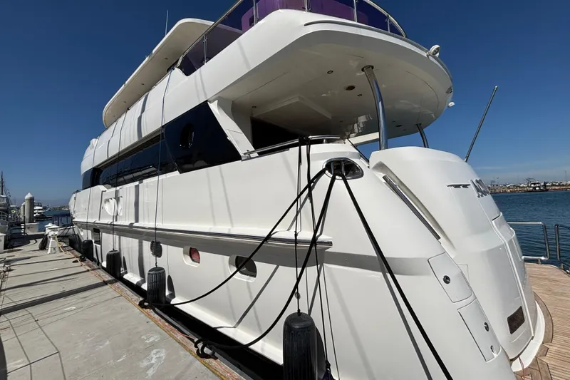 Slide: The Image of Luxury 2010 Norseman 80 yacht docked at marina under clear blue sky. - 116