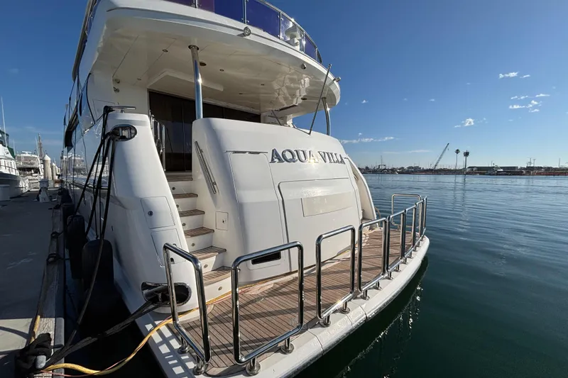 Slide: The Image of Luxury yacht Norseman 80, 2010 model, docked at marina with clear blue sky. - 117