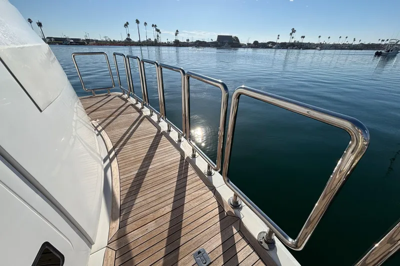 Slide: The Image of Deck of 2010 Norseman 80 yacht with stainless steel railings and scenic harbor view. - 119
