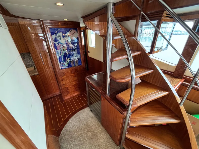 Slide: The Image of Luxurious wooden interior of 2010 Norseman 80 yacht with spiral staircase. - 12
