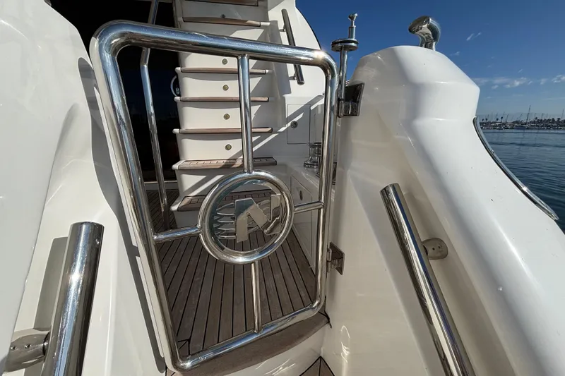 Slide: The Image of Stainless steel gate on 2010 Norseman 80 yacht with wooden deck and marina view. - 122