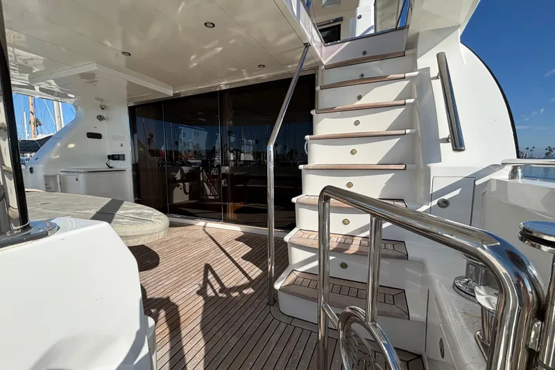 Slide: The Image of Luxurious Norseman 80 yacht deck with wooden flooring and elegant staircase, 2010 model. - 123