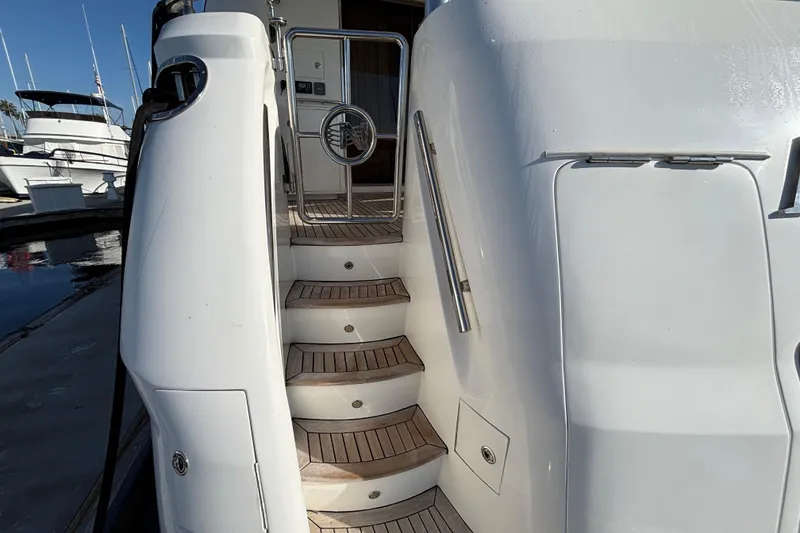 Slide: The Image of Staircase on a 2010 Norseman 80 yacht, featuring sleek design and wooden steps. - 124