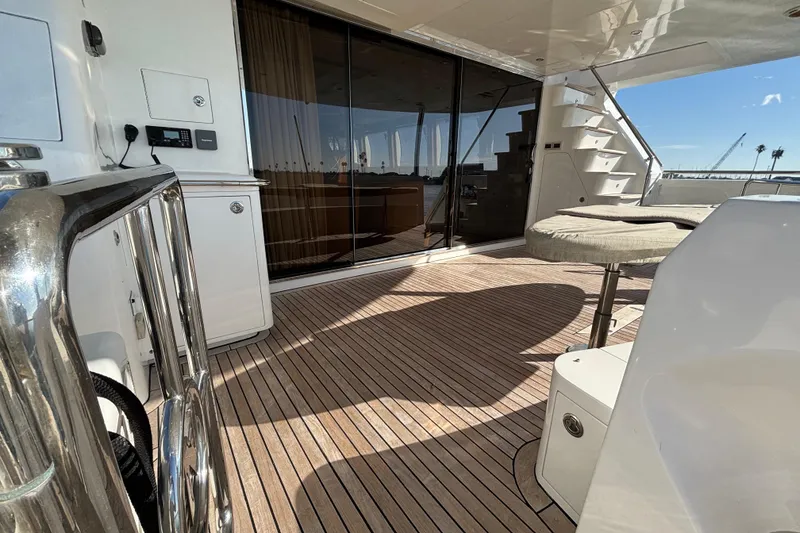 Slide: The Image of Luxurious Norseman 80 yacht deck with wooden flooring and modern amenities, 2010 model. - 125