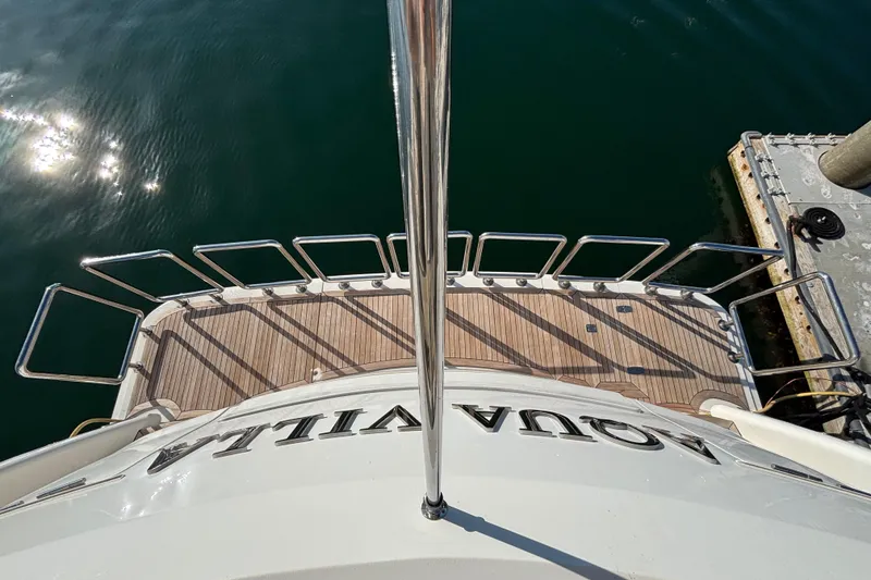Slide: The Image of Aerial view of Norseman 80 yacht deck, 2010 model, docked by the water. - 126