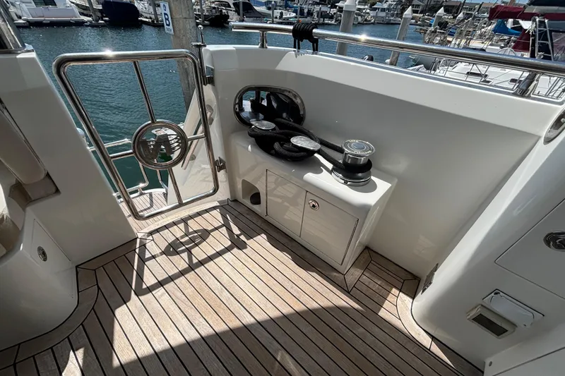 Slide: The Image of Deck area of 2010 Norseman 80 yacht with winch and railing, docked at marina. - 130