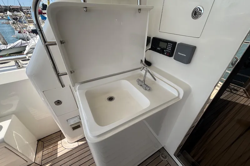 Slide: The Image of Boat sink area on 2010 Norseman 80 yacht, featuring a faucet and marine electronics. - 132