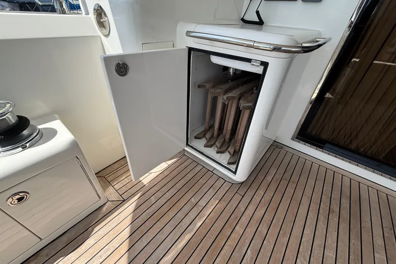 Slide: The Image of Open storage compartment on 2010 Norseman 80 yacht with wooden deck flooring. - 133