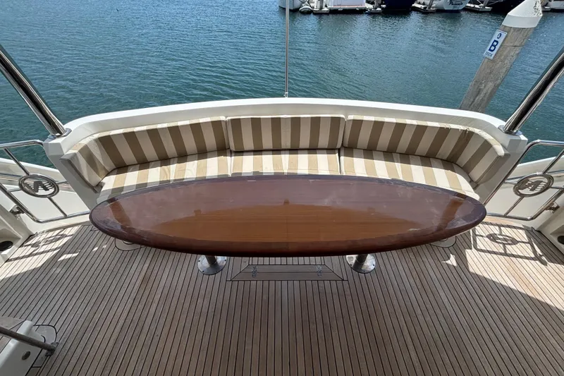 Slide: The Image of Luxury yacht deck with striped seating and polished wooden table, Norseman 80, 2010 model. - 137