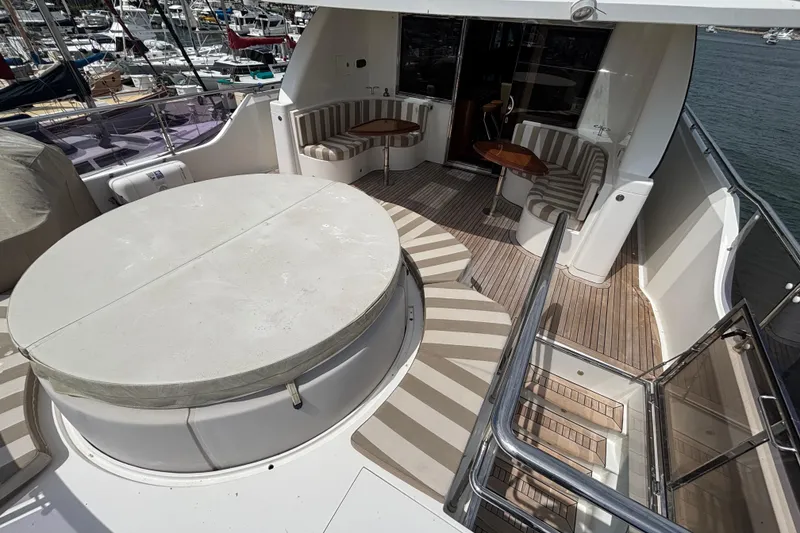 Slide: The Image of Luxurious 2010 Norseman 80 yacht deck with seating and covered hot tub. - 142