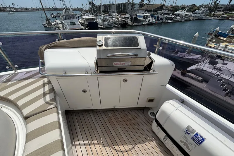 Slide: The Image of Outdoor grill on 2010 Norseman 80 yacht deck, overlooking marina with boats. - 145