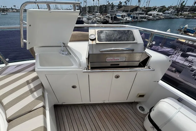 Slide: The Image of Outdoor kitchen on 2010 Norseman 80 yacht with sink and grill, docked at marina. - 146