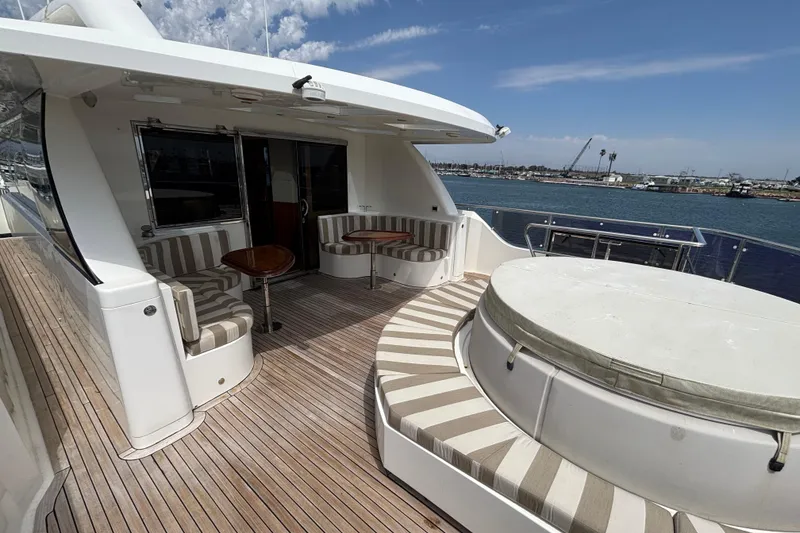 Slide: The Image of Luxury Norseman 80 yacht deck with seating, 2010 model, overlooking serene waterfront. - 147
