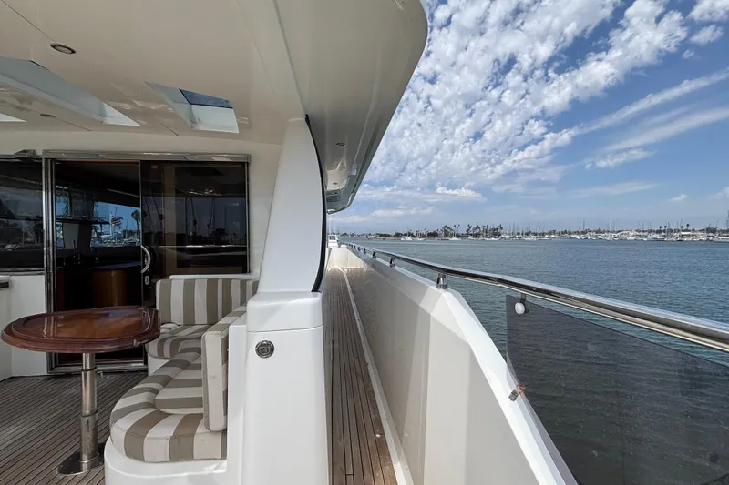 Slide: The Image of Luxury Norseman 80 yacht deck with seating, ocean view, and clear skies, 2010 model. - 148