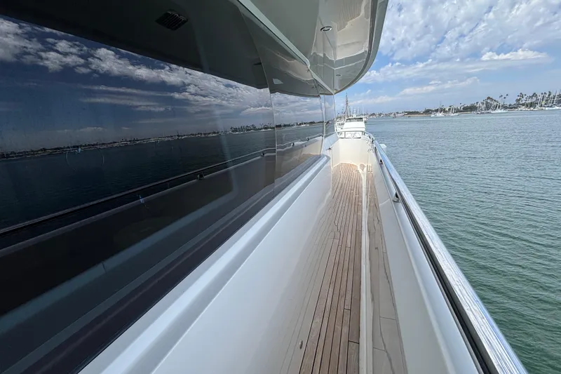 Slide: The Image of Side deck view of 2010 Norseman 80 yacht with ocean and sky reflections. - 149