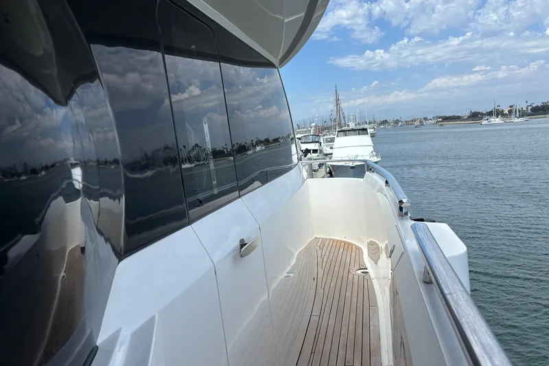 Slide: The Image of Side view of 2010 Norseman 80 yacht on calm water, reflecting sky and marina. - 150