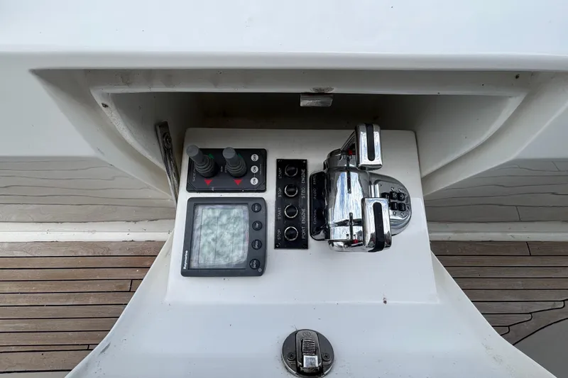 Slide: The Image of Control panel of a 2010 Norseman 80 yacht with navigation and throttle controls. - 152