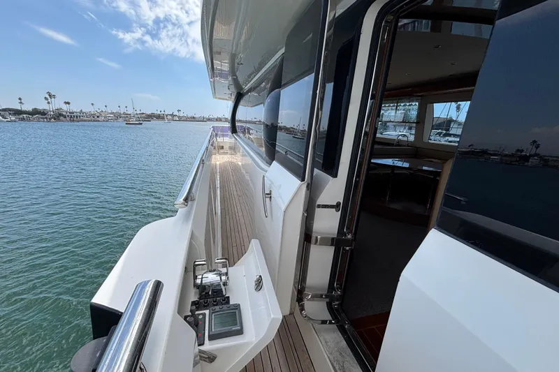 Slide: The Image of 2010 Norseman 80 yacht deck with ocean view and open cabin door. - 154