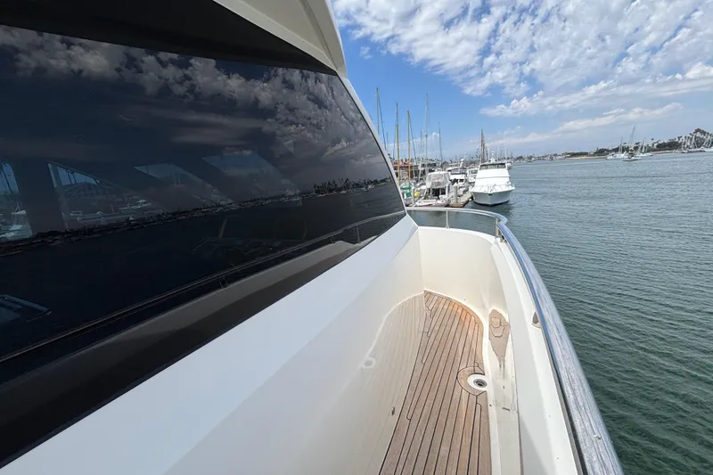 Slide: The Image of 2010 Norseman 80 yacht docked at marina, reflecting sky and water. - 155